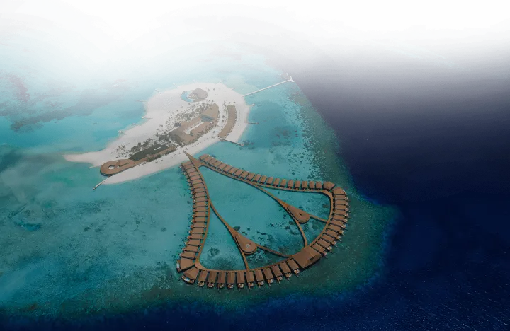 Cinnamon Velifushi Maldives — вид сверху на зеленый остров и водные виллы