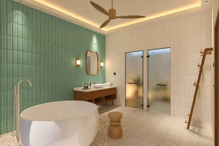dusitD2 Feydhoo Maldives — светлая ванная комната водной виллы с отдельно стоящей ванной у окна