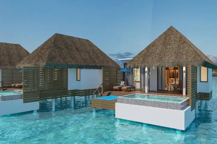 dusitD2 Feydhoo Maldives — песчаный берег острова с лазурной водой и шезлонгами для отдыха