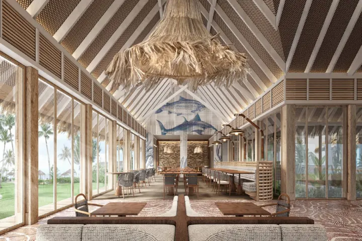 dusitD2 Feydhoo Maldives — просторный зал ресторана с открытой террасой и видом на океан